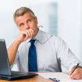 Absorbed pensive mature businessman
